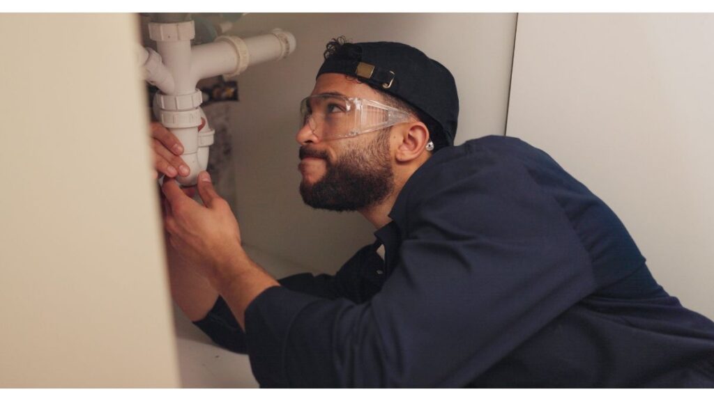 Pipe Patrol AZ plumber inspecting a home to prevent plumbing emergencies
