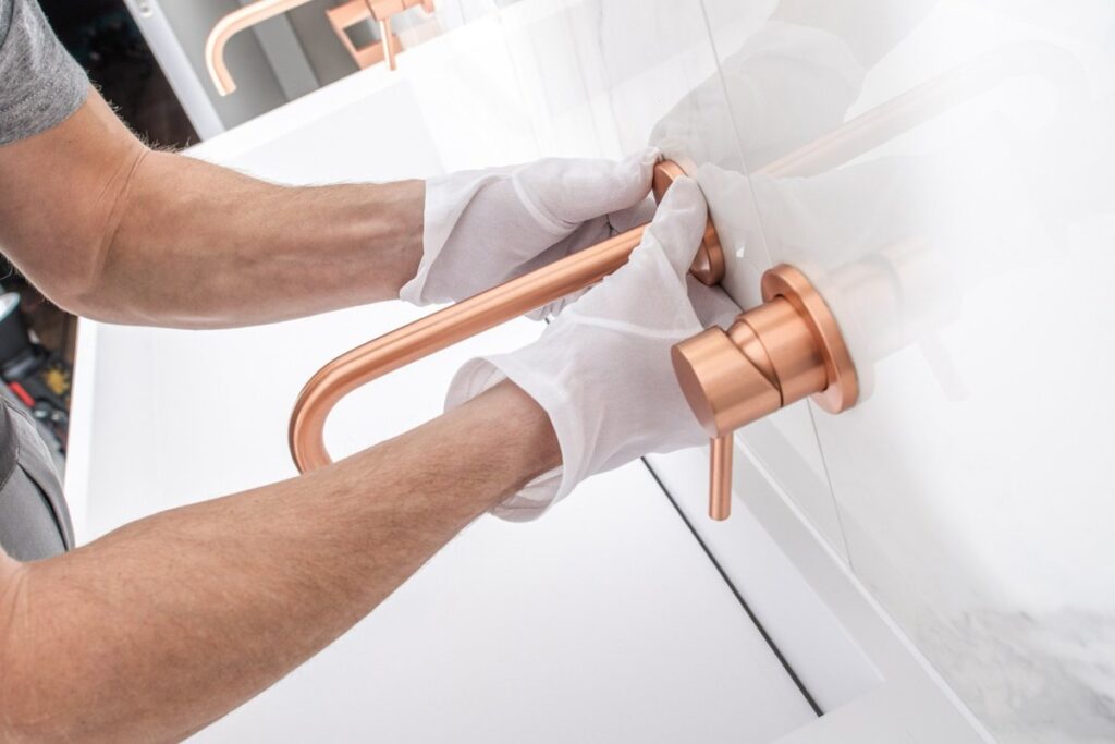 Pipe Patrol AZ plumber installing a bathroom fixture
