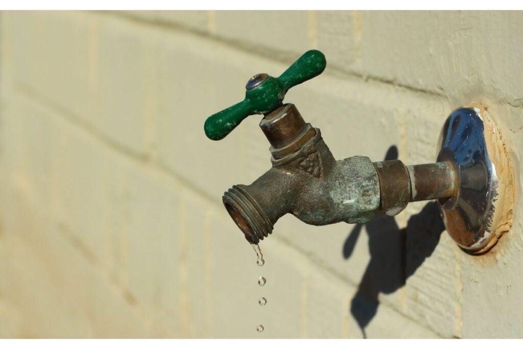 Pipe Patrol AZ plumber repairing a leaking outdoor hose bib
