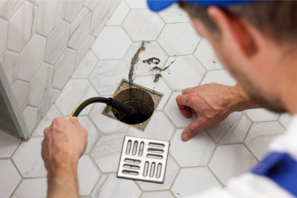 Pipe Patrol AZ plumber performing professional floor drain cleaning

