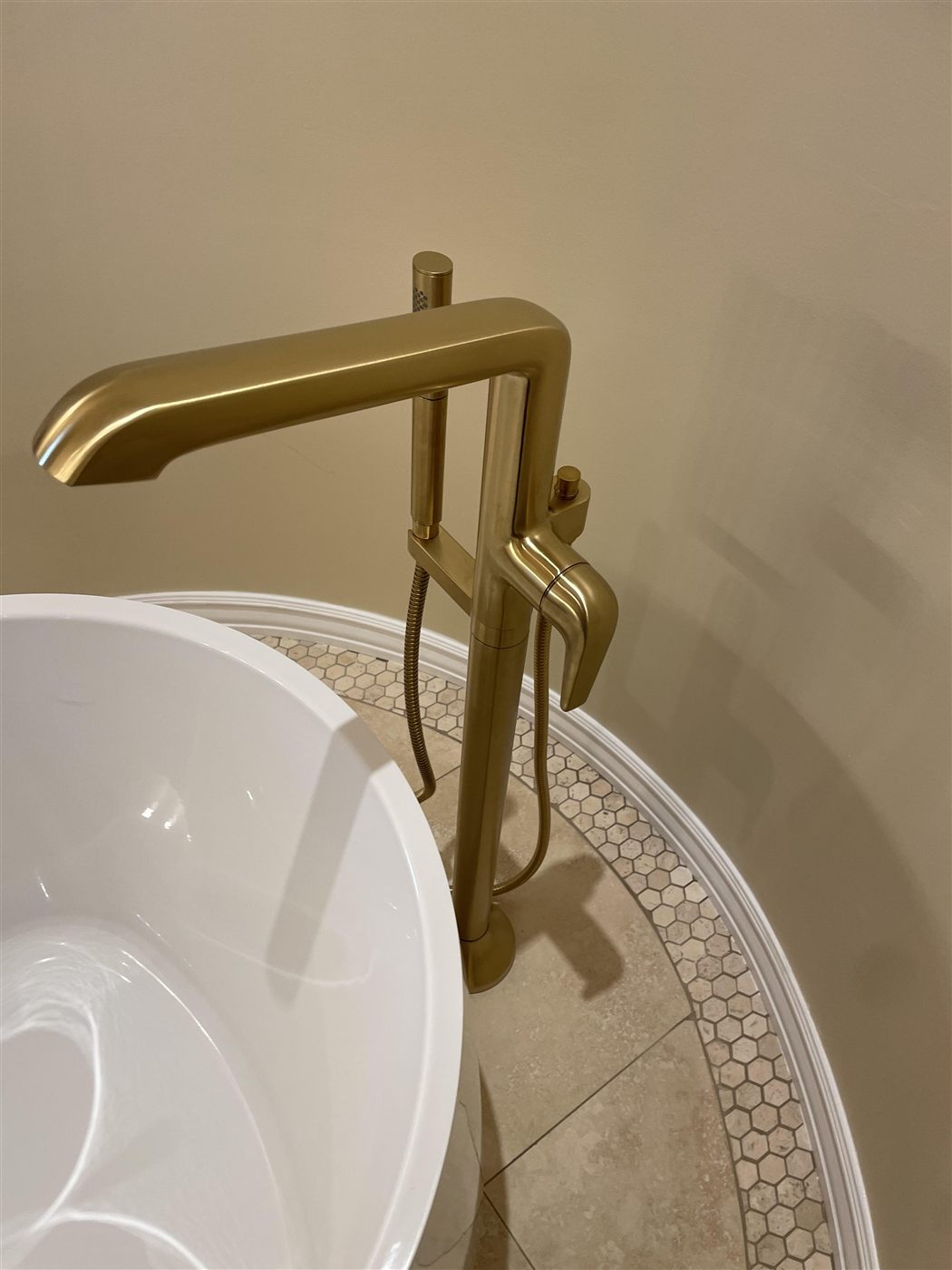 About Brushed-gold floor-mount freestanding tub filler installed by Pipe Patrol