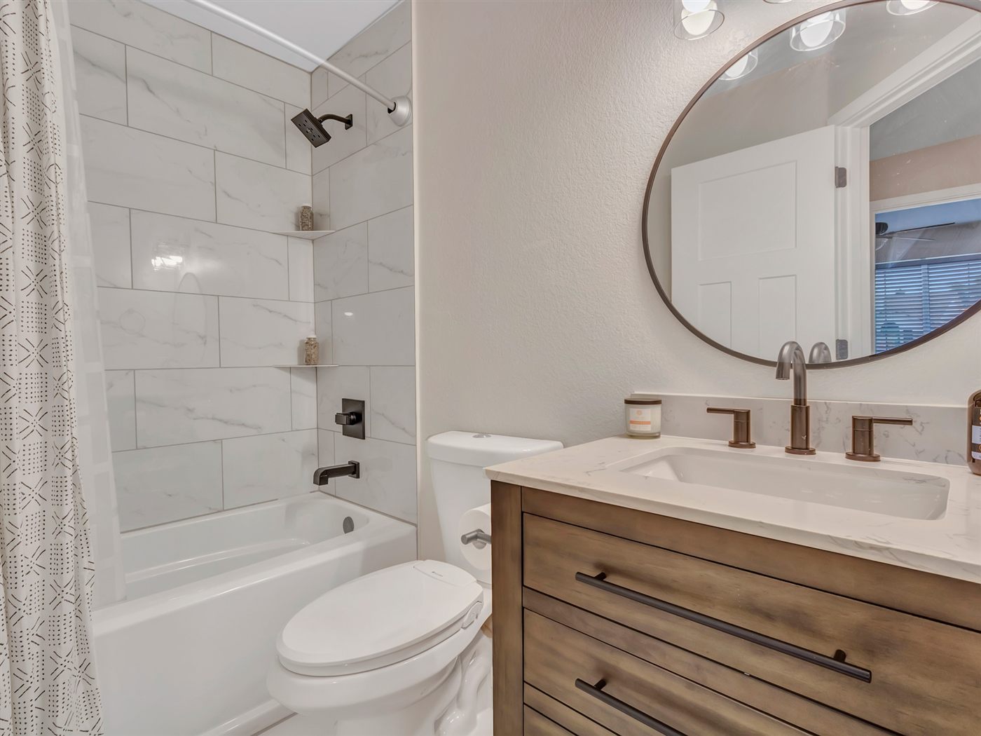 About Hall bathroom remodel with tub, tile surround, and new vanity