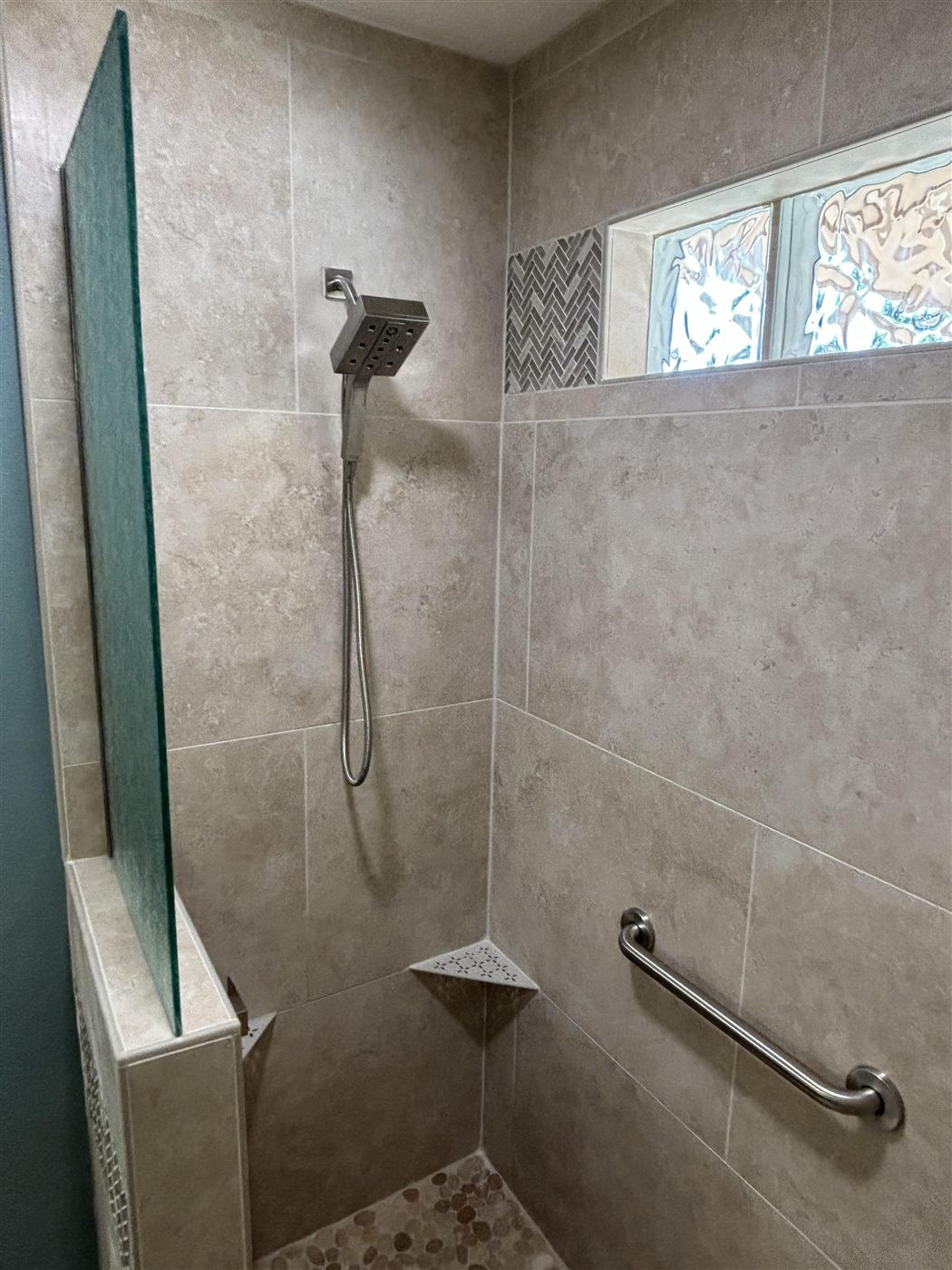 About Walk-in shower remodel with tile surround and safety grab bar